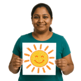 A woman holding up a drawing of the sun.