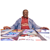 A man with lots of comics on a table in front of him.