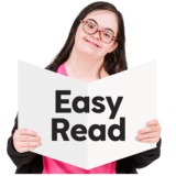 A girl holding up a big Easy Read report.