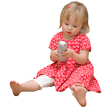 A very young girl playing with a toy phone.