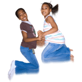 Two girls jumping in the air with jeans on.