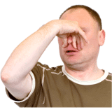 A man with a green top holding his nose.