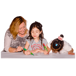 Two girls drawing with an adult woman helping them.